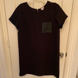 Black dress with leather pocket